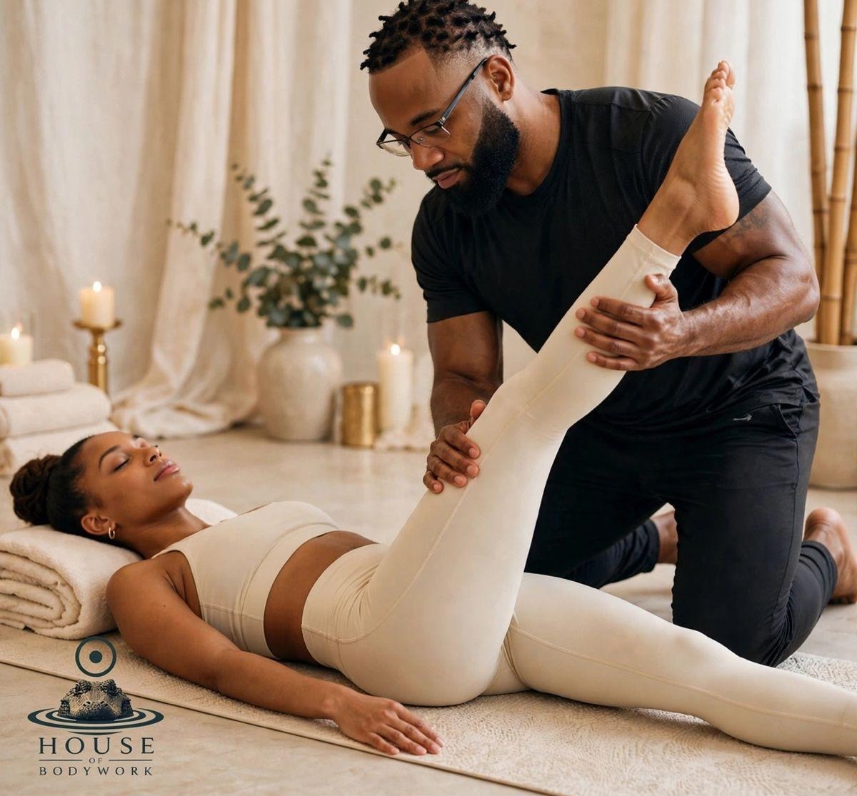 Tenichi performing an assisted hamstring stretch